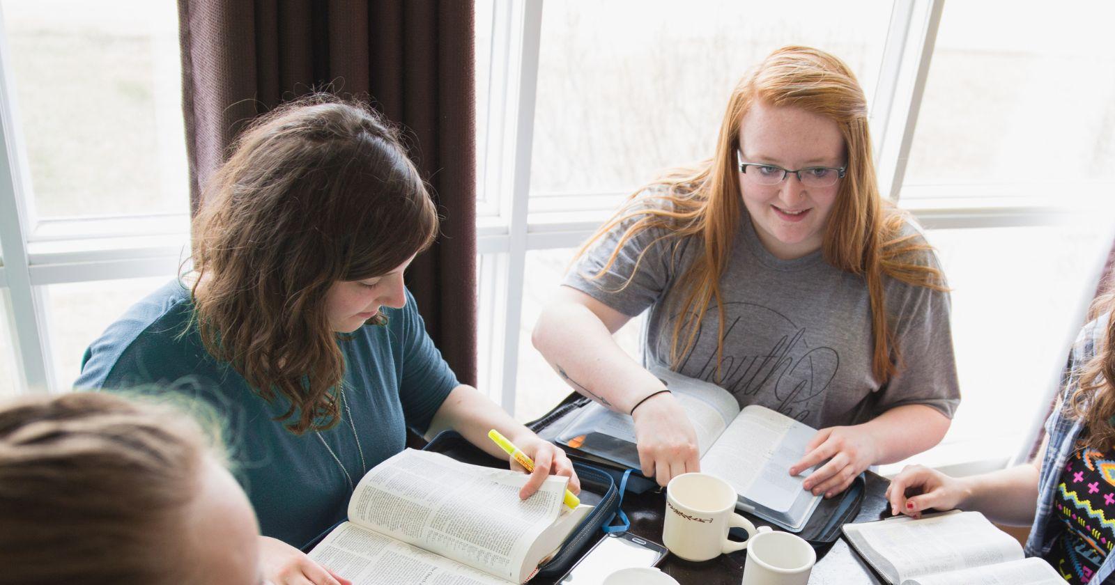 Renee Cyr in blue shirt, studying with fellow English students.