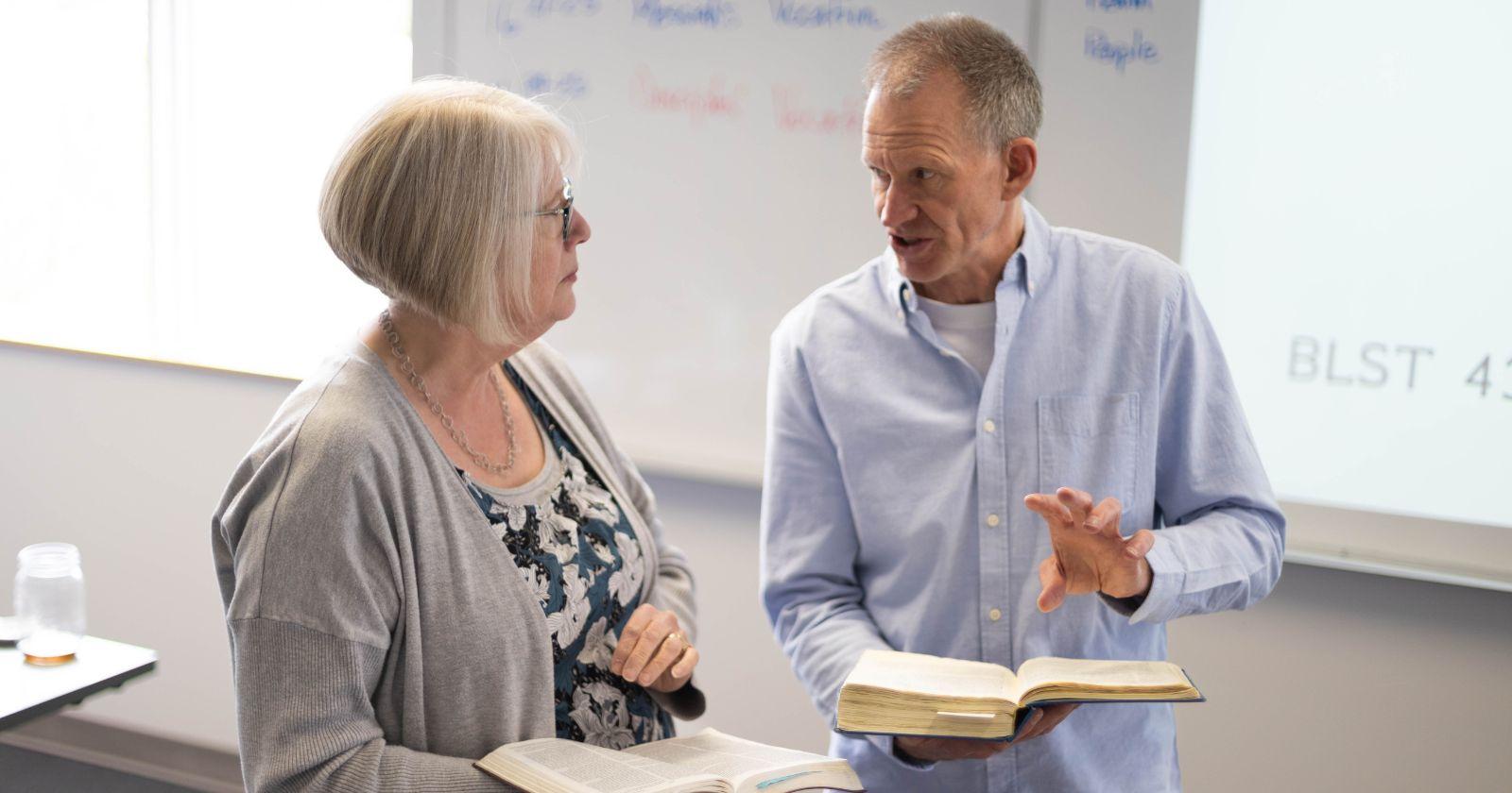 Dr. Wes Olmstead helping a college student