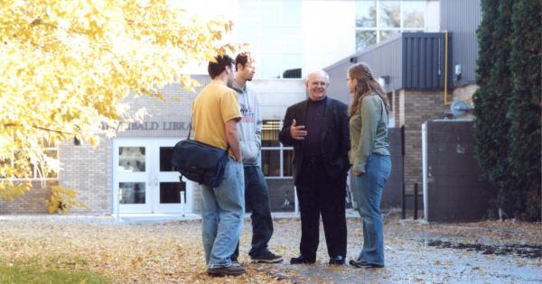 Paul Magnus with Students in front of Briercrest College & Seminary